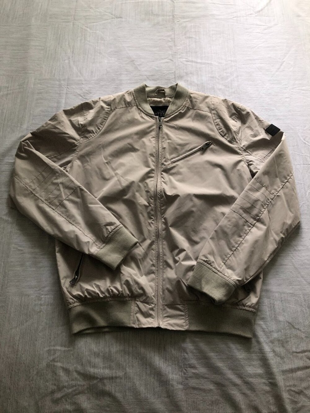 Threadbare beige bomber jacket